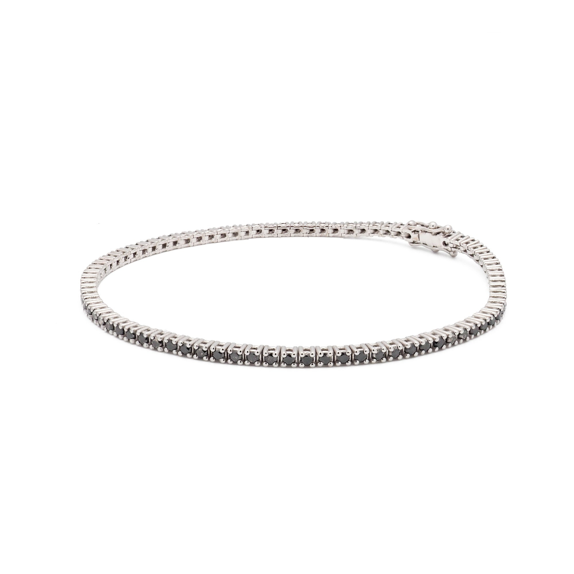 Pulsera riviere de oro blanco y diamantes negros